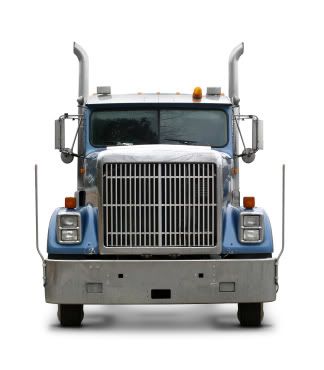 big truck behind small cyclist