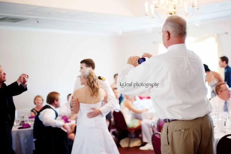 bride and groom pose for pictures