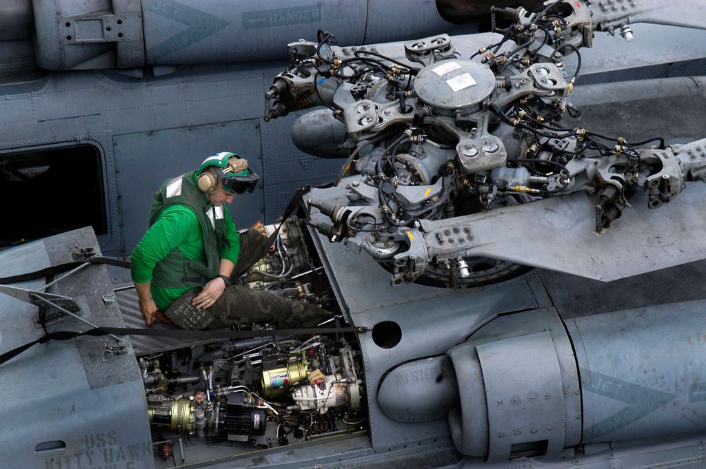 US_Navy_050525-N-0167B-011_An_Aviation_Electronics_Technician_performs_corrosion_control_on_an_HH-60H_Seahawk_helicopter_zpsu4z4fxir.jpg